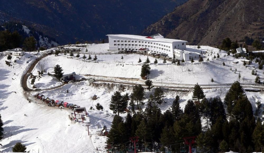 Malam Jabba Ski Resort covered in snow with chairlift, hotel, and surrounding mountains in Swat Valley, Pakistan